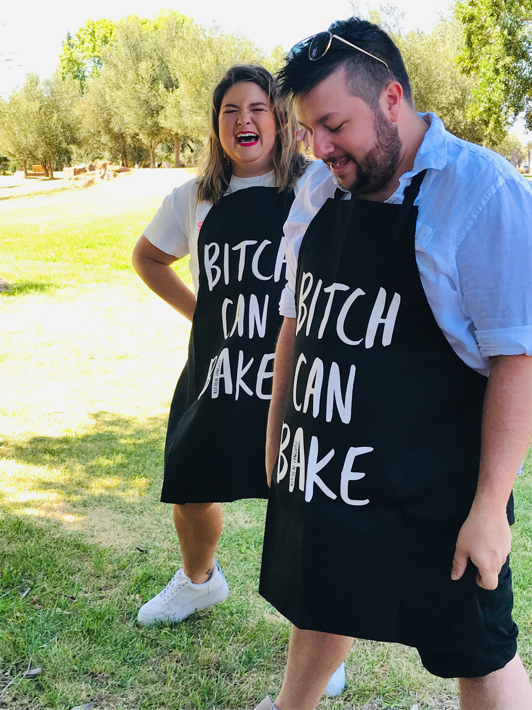 Christian Hull and Emmy Lou loving their Bitch Can Bake aprons